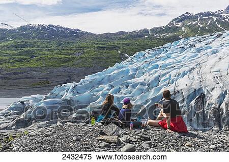Couple with daughter having a snack overlooking a glacier, Shoup Bay State Marine Park, Prince William Sound; Valdez, Alaska, United States of America View Large Photo Image Stock Photography - Couple with daughter having a snack overlooking a glacier, Shoup Bay State Marine Park, Prince William Sound; Valdez, Alaska, United States of America. Fotosearch