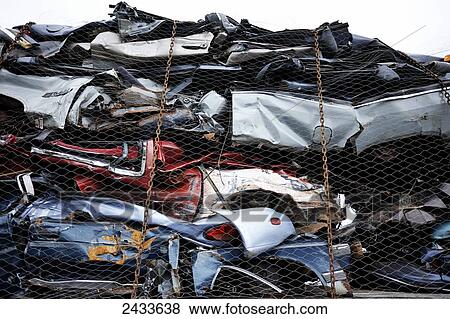 Stock Photo - Crushed cars at Bickerdike Port in Old Montreal; Montreal, Quebec, Canada. Fotosearch