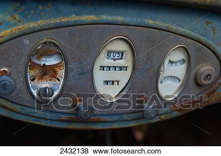 Stock Photo - Details of the dashboard of an antique car; Yukon, Canada. Fotosearch