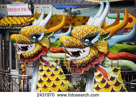 Stock Image - Dragon Boats on the Perfume River; Hue, Vietnam. Fotosearch