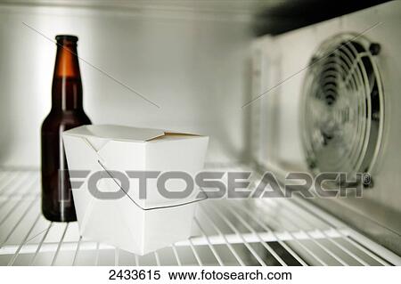 Empty interior of a commercial stainless steel refrigerator with only a white chinese take out box and a bottle of beer; Montreal, Quebec, Canada View Large Photo Image Stock Photography - Empty interior of a commercial stainless steel refrigerator with only a white chinese take out box and a bottle of beer; Montreal, Quebec, Canada. Fotosearch