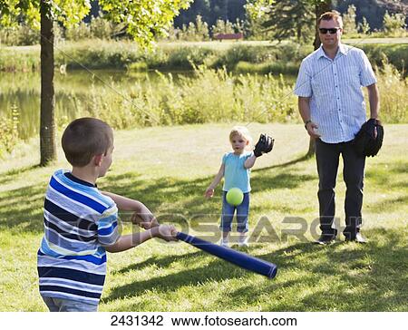 Father, son and daughter playing baseball in a park; Edmonton, Alberta, Canada View Large Photo Image Stock Image - Father, son and daughter playing baseball in a park; Edmonton, Alberta, Canada. Fotosearch