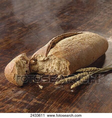 Fresh bread on a cupboard with wheat View Large Photo Image Stock Image - Fresh bread on a cupboard with wheat. Fotosearch