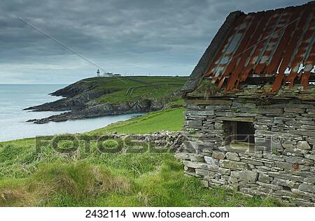 Picture - Galley Head Lighthouse in West Cork on the Wild Atlantic Way coastal route; County Cork, Ireland. Fotosearch