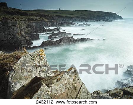Stock Image - Galley Head Lighthouse in West Cork on the Wild Atlantic Way coastal route; County Cork, Ireland. Fotosearch