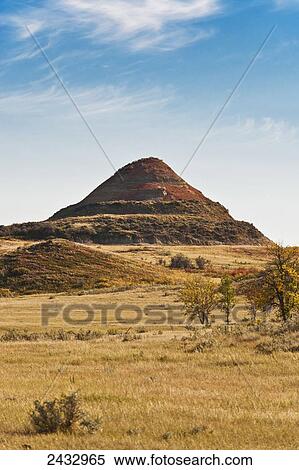 Hill in a pasture on the Little Missouri National Grasslands; North Dakota, United States of America View Large Photo Image Stock Photography - Hill in a pasture on the Little Missouri National Grasslands; North Dakota, United States of America. Fotosearch