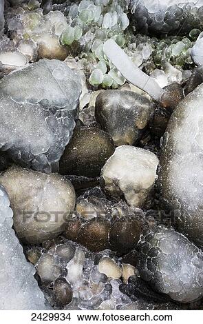 Ice covers the rocks near a waterfall; Olney, Oregon, United States of America View Large Photo Image Picture - Ice covers the rocks near a waterfall; Olney, Oregon, United States of America. Fotosearch