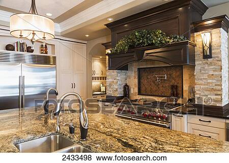 Stock Photo - Kitchen in luxurious custom built estate home; Edmonton, Alberta, Canada. Fotosearch