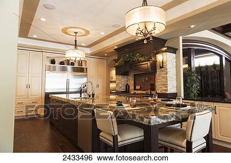 Stock Photograph - Kitchen in luxurious custom built estate home; Edmonton, Alberta, Canada. Fotosearch
