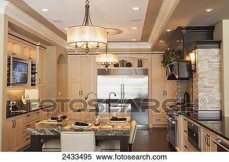 Stock Photography - Kitchen in luxurious custom built estate home; Edmonton, Alberta, Canada. Fotosearch