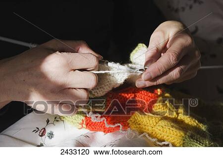 Knitting a woollen multi-coloured scarf; London, England View Large Photo Image Stock Image - Knitting a woollen multi-coloured scarf; London, England. Fotosearch