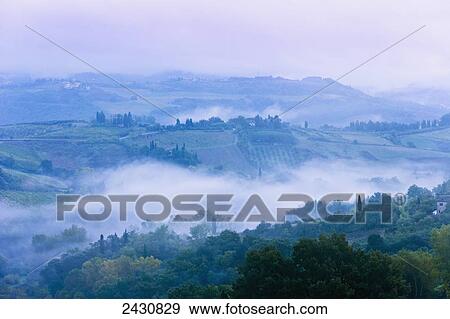 Landscape with low cloud, near San Gimignano; Tuscany, Italy View Large Photo Image Stock Photo - Landscape with low cloud, near San Gimignano; Tuscany, Italy. Fotosearch