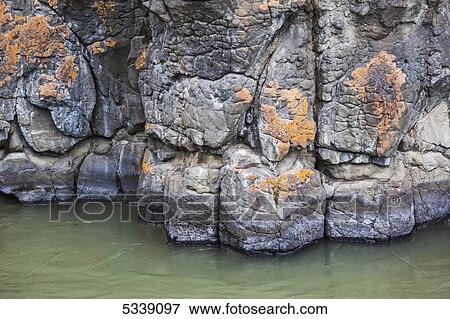 Lichen coloured basalt columns of Miles Canyon; Whitehorse, Yukon, Canada View Large Photo Image Stock Photo - Lichen coloured basalt columns of Miles Canyon; Whitehorse, Yukon, Canada. Fotosearch