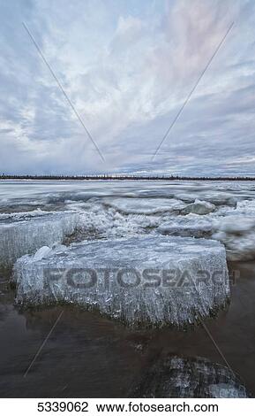Long exposure of the ice flowing down the Porcupine River after it broke up; Old crow, Yukon, Canada View Large Photo Image Stock Image - Long exposure of the ice flowing down the Porcupine River after it broke up; Old crow, Yukon, Canada. Fotosearch