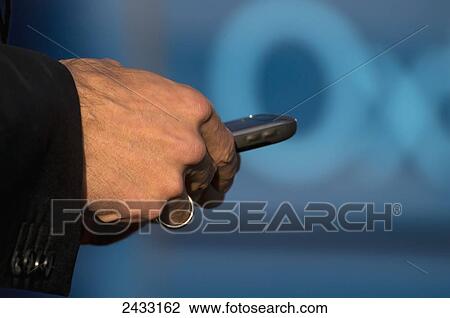 Male hands using a smartphone; England View Large Photo Image Stock Image - Male hands using a smartphone; England. Fotosearch
