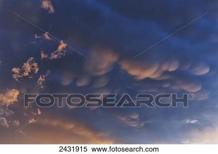 Stock Photography - Mammatus clouds at sunset; Cochabamba, Bolivia. Fotosearch