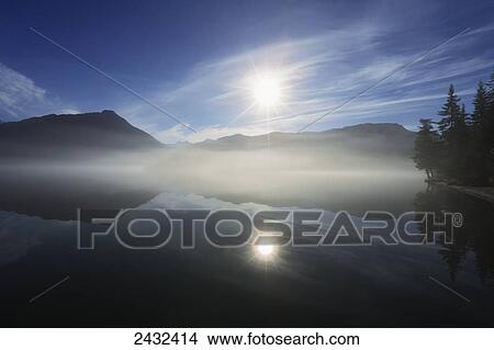 Morning fog clears off Mendenhall Lake, Tongass National Forest, Juneau, Alaska. View Large Photo Image Picture - Morning fog clears off Mendenhall Lake, Tongass National Forest, Juneau, Alaska.. Fotosearch