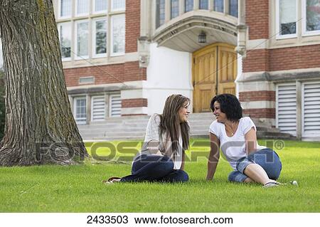 Mother and daughter spending quality time together in a school yard; Edmonton, Alberta, Canada View Large Photo Image Stock Image - Mother and daughter spending quality time together in a school yard; Edmonton, Alberta, Canada. Fotosearch