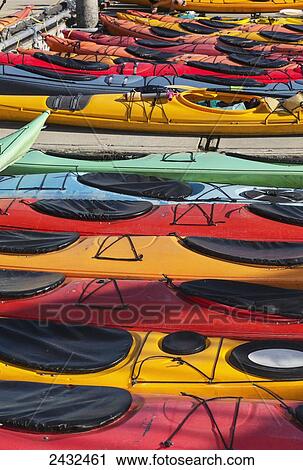 Multi-coloured kayaks together at boat dock, Prince William Sound; Valdez, Alaska, United States of America View Large Photo Image Stock Image - Multi-coloured kayaks together at boat dock, Prince William Sound; Valdez, Alaska, United States of America. Fotosearch