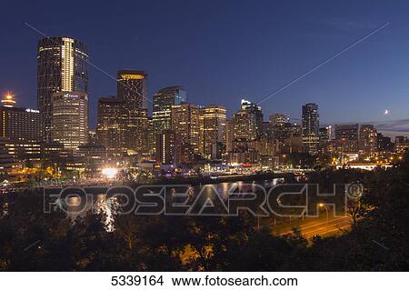 North American city skyline with skyscrapers at nighttime; Calgary, Alberta, Canada View Large Photo Image Picture - North American city skyline with skyscrapers at nighttime; Calgary, Alberta, Canada. Fotosearch