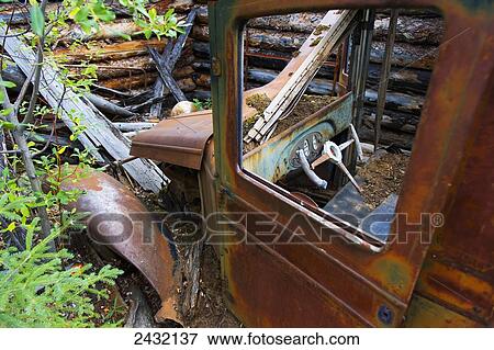 Stock Photo - Old truck in the forest; Yukon, Canada. Fotosearch