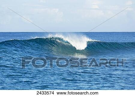 Perfect empty waves break in tropical ocean in the South Pacific; Tahiti, French Polynesia View Large Photo Image Picture - Perfect empty waves break in tropical ocean in the South Pacific; Tahiti, French Polynesia. Fotosearch