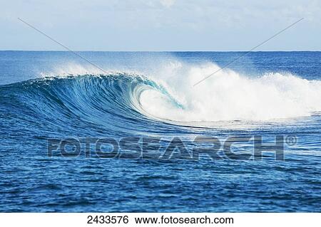 Perfect empty waves break in tropical ocean in the South Pacific; Tahiti, French Polynesia View Large Photo Image Stock Photograph - Perfect empty waves break in tropical ocean in the South Pacific; Tahiti, French Polynesia. Fotosearch