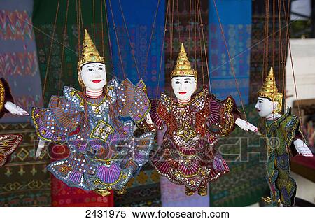 Stock Photography - Puppets for sale in street market; Luang Prabang, Laos. Fotosearch