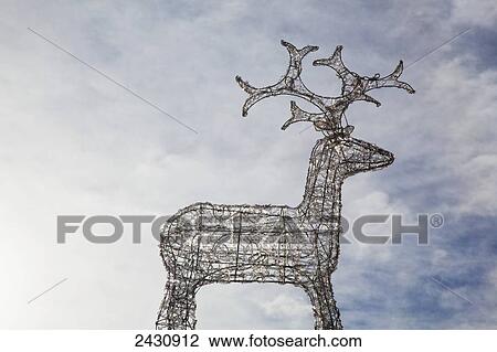 Sculpture of a deer against a cloudy sky; Murnau, Bavaria, Germany View Large Photo Image Stock Image - Sculpture of a deer against a cloudy sky; Murnau, Bavaria, Germany. Fotosearch