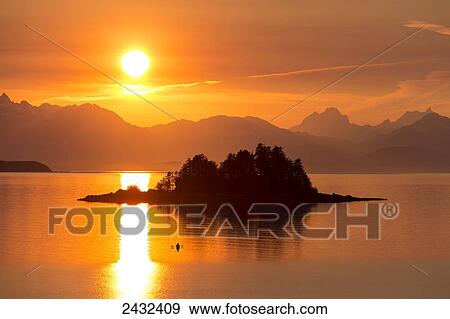 Sea kayaker at sunset, Favorite Channel, Inside Passage Alaska, near Juneau. Chilkat Mountains and Lynn Canal beyond. View Large Photo Image Stock Photo - Sea kayaker at sunset, Favorite Channel, Inside Passage Alaska, near Juneau. Chilkat Mountains and Lynn Canal beyond.. Fotosearch