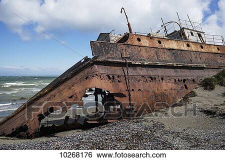 Stock Photograph - Shipwreck on the shore; Santa Cruz province, Argentina. Fotosearch