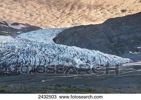 Shoup Glacier spilling over the Chugach mountains with glowing cloudy sky, Shoup Bay State Marine Park, Prince William Sound; Valdez, Alaska, United States of America View Large Photo Image Stock Image - Shoup Glacier spilling over the Chugach mountains with glowing cloudy sky, Shoup Bay State Marine Park, Prince William Sound; Valdez, Alaska, United States of America. Fotosearch