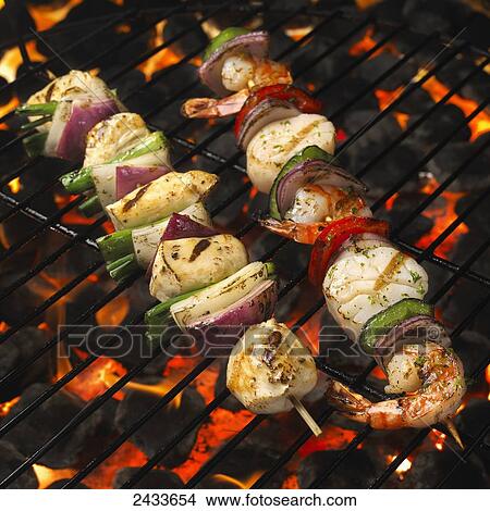Skewers with chicken and vegetables on the grill View Large Photo Image Picture - Skewers with chicken and vegetables on the grill. Fotosearch