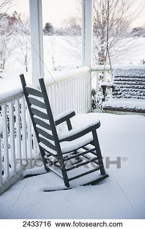 Snow covered rocking chair and porch swing on front porch after a snowstorm; Fallston, Maryland, United States of America View Large Photo Image Stock Photograph - Snow covered rocking chair and porch swing on front porch after a snowstorm; Fallston, Maryland, United States of America. Fotosearch