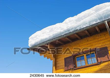 Snow of a rooftop against a blue sky; San Bernardino, Grisons, Switzerland View Large Photo Image Stock Photography - Snow of a rooftop against a blue sky; San Bernardino, Grisons, Switzerland. Fotosearch