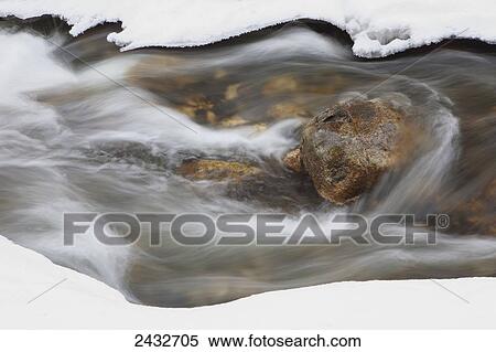 Stock Photography - Spring runoff on the West branch of the Credit River; Caledon, Ontario, Canada. Fotosearch
