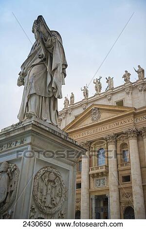 Stock Image - Statue and St. Peter's Basilica; Rome, Lazia, Italy. Fotosearch