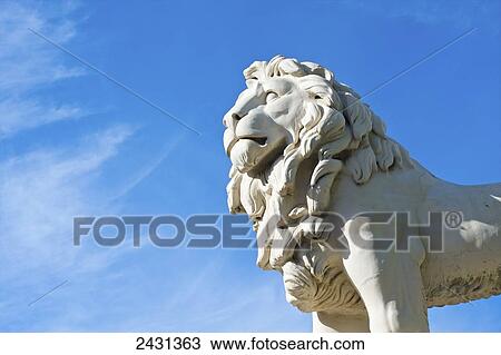 Statue of a lion against a blue sky, Trafalgar Square; London, England View Large Photo Image Stock Image - Statue of a lion against a blue sky, Trafalgar Square; London, England. Fotosearch