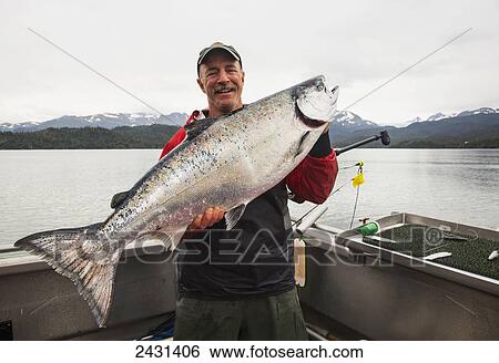 Success catching King Salmon near Homer, Kachemak Bay; Alaska, United States of America View Large Photo Image Stock Photograph - Success catching King Salmon near Homer, Kachemak Bay; Alaska, United States of America. Fotosearch