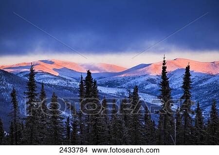 Sunset grows on the mountains in winter, Chena River State Recreation Area, Fairbanks, Alaska, United States of America View Large Photo Image Picture - Sunset grows on the mountains in winter, Chena River State Recreation Area, Fairbanks, Alaska, United States of America. Fotosearch