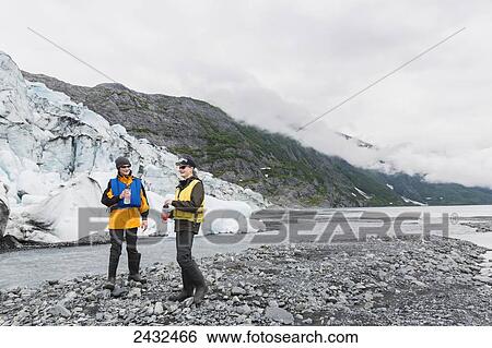 Teenage boys standing in front of Shoup glacier and Chugach mountains, Shoup Bay State Marine Park, Prince William Sound; Valdez, Alaska, United States of America View Large Photo Image Stock Photograph - Teenage boys standing in front of Shoup glacier and Chugach mountains, Shoup Bay State Marine Park, Prince William Sound; Valdez, Alaska, United States of America. Fotosearch