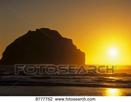 The sun sets near Face Rock; Bandon, Oregon, United States of America View Large Photo Image Stock Image - The sun sets near Face Rock; Bandon, Oregon, United States of America. Fotosearch