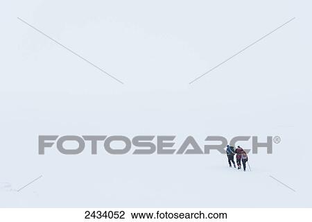 Three walkers in whiteout conditions on snowy, winter walk towards top of Geal Charn, near Laggan; Scotland View Large Photo Image Stock Image - Three walkers in whiteout conditions on snowy, winter walk towards top of Geal Charn, near Laggan; Scotland. Fotosearch