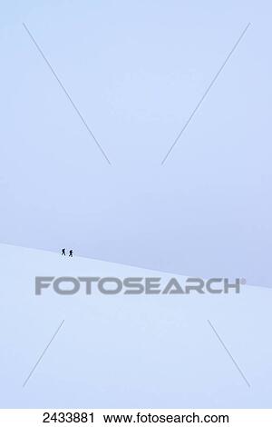 Two people walking along ridge in snow covered, winter conditions on Beinn an Dothaidh, near Bridge of Orchy; Argyll and Bute, Scotland View Large Photo Image Stock Image - Two people walking along ridge in snow covered, winter conditions on Beinn an Dothaidh, near Bridge of Orchy; Argyll and Bute, Scotland. Fotosearch