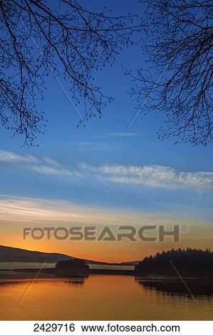 View from the walking trail along the beach at Auke Recreation area at sunset; Juneau, Alaska, United States of America View Large Photo Image Stock Photograph - View from the walking trail along the beach at Auke Recreation area at sunset; Juneau, Alaska, United States of America. Fotosearch