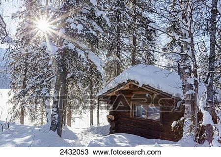 View of a public use log cabin at Byers Lake in fresh snow under a sun burst, Interior Alaska; Alaska, United States of America View Large Photo Image Stock Image - View of a public use log cabin at Byers Lake in fresh snow under a sun burst, Interior Alaska; Alaska, United States of America. Fotosearch