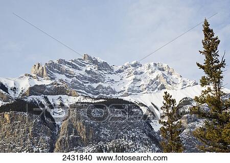 Stock Image - View of the Rocky Mountains in winter, near Banff; Canmore, Alberta, Canada. Fotosearch