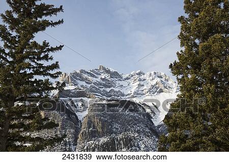 View of the Rocky Mountains in winter, near Banff; Alberta, Canada View Large Photo Image Stock Photo - View of the Rocky Mountains in winter, near Banff; Alberta, Canada. Fotosearch