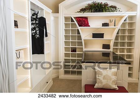 Walk-in closet in luxurious custom built estate home; Edmonton, Alberta, Canada View Large Photo Image Stock Image - Walk-in closet in luxurious custom built estate home; Edmonton, Alberta, Canada. Fotosearch