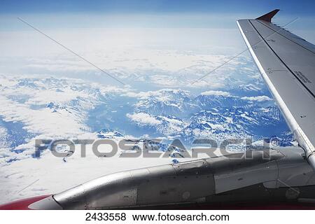 Window view from airplane while departing Anchorage; Anchorage, Alaska, United States of America View Large Photo Image Stock Photo - Window view from airplane while departing Anchorage; Anchorage, Alaska, United States of America. Fotosearch